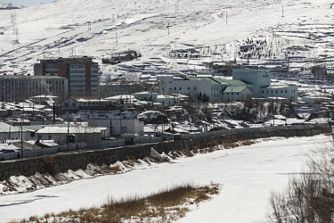 A view of the town of Hyesan, North Korea, seen from across the border, formed by the frozen Yalu River, in Changbai.