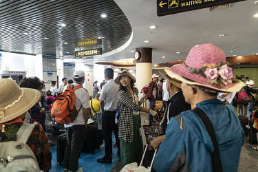 Tourists wait to take a cruise towards the disputed Spratley Islands in the South China Sea, at a terminal in Sanya.