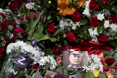 A photo of Stalin and a bouquet of flowers with a 'Z' logo (from Dutch flower company Zentoo) lies among the blooms at the Tiergarten on 8 May 2022, the 77th anniversary of the 1945 victory against Na...