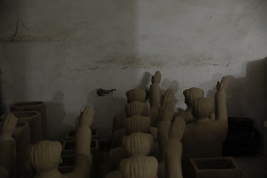 Busts of former Chinese leader Mao Zedong sit on a shelf inside a workshop at the Jingdezhen Porcelain Factory.