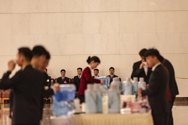 Attendants prepare tea during a voting session at the first session of the 13th National People's Congress (NPC) at the Great Hall of the People.