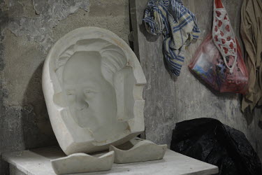 A Mao Zedong mold to make bust of the former Chinese leader sits on a table inside a workshop at the Jingdezhen Porcelain Factory.