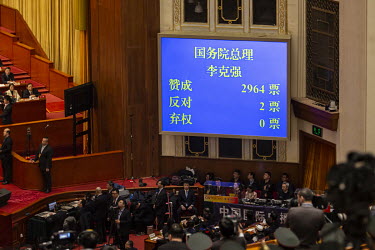 A voting screen shows almost unanimous consensus to give Premier Li Keqiang a second term, at the 13th National People's Congress (NPC) at the Great Hall of the People.