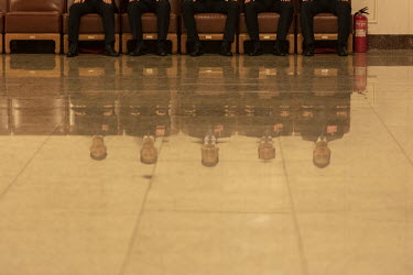 Attendants sit in a hall at the 13th National People's Congress (NPC) at the Great Hall of the People.