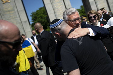 Andriy Melnyk, the Ukrainian Ambassador to Germany, greets a man at the Soviet war memorial in the Tiergarten on 8 May 2022, the 77th anniversary of the 1945 victory against Nazi Germany and the end o...