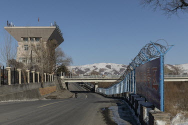 A barbed wire fence running along the border crossing in the town of Changbai on China's border with North Korea.