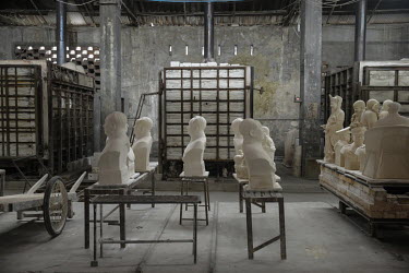 Busts of former Chinese leader Mao Zedong sit on a shelf inside a workshop at the Jingdezhen Porcelain Factory.