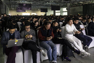 Attendees wait for the keynote speech to start at the WeChat Open Class Pro conference.