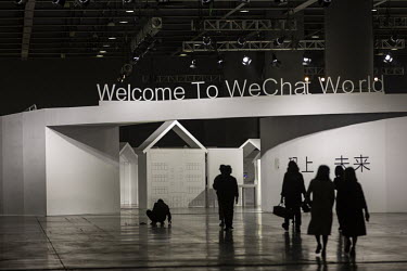Attendees walk through the WeChat Open Class Pro conference.