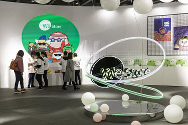 Attendees at the WeStore booth at Tencent Holdings Ltd.'s WeChat Open Class Pro conference