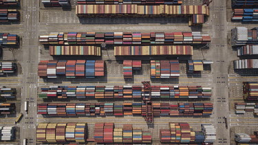 Shipping containers sit stacked in a terminal at the Yangshan Deep Water Port.