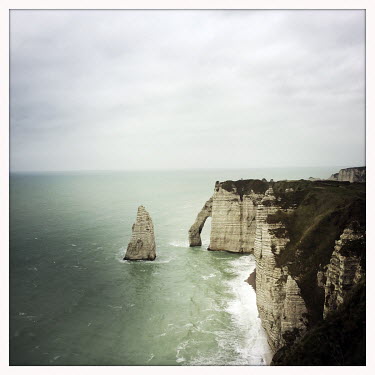 The Etretat chalk cliffs, arches and stacks in the English Channel.