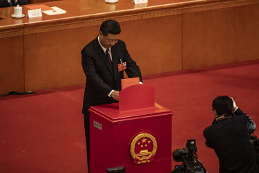 Xi Jinping, China's president, casts his ballot during a vote at a session at the first session of the 13th National People's Congress (NPC) at the Great Hall of the People.