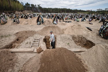 Graves being prepared at a cemetery.