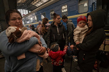 People arrive at Lviv railway station after a long night travelling from Zaporizhzhia. Lena (left) fled with her family from Orikhiv, which is southeast of Zaporizhzhia close to the front line. "The t...