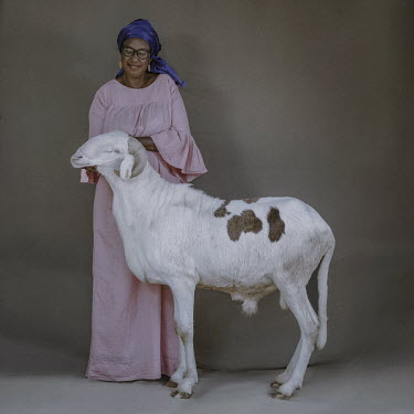 Madame Sow Fatoumata Ka with Amath a two year old Ladoum ram that is 95cm at the withers and 183cm long.Ladoum sheep are a cross between Mauritanian touabir and Malian bali-bali. They're renowned for...