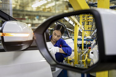 Employees operate in the SAIC-GM-Wuling Automobile Co. Baojun Base plant, a joint venture between SAIC Motor Corp., General Motors Co. and Liuzhou Wuling Automobile Industry Co., in Liuzhou, Guangxi p...