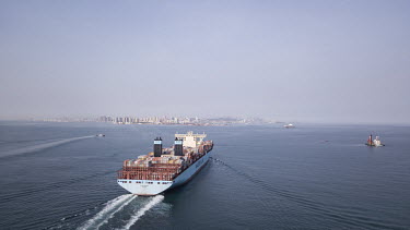 A Maersk container ship sails out of Qingdao Qianwan Container Terminal.