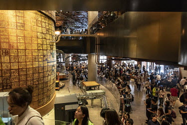 Customers crowd inside the Starbucks Corp. Reserve Roastery store.