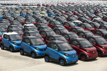 Wuling E1oo mini EV models sit in a parking lot at the SAIC-GM-Wuling Automobile Co. Baojun Base plant, a joint venture between SAIC Motor Corp., General Motors Co. and Liuzhou Wuling Automobile Indus...