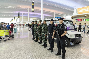 Security personnel stand guard in the newly opened Terminal 2 of the Guangzhou Baiyun International Airport.