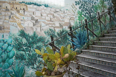 A mural on a stairway in the town centre.