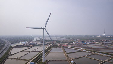 Wind turbines manufactured by Shanghai Electric Group Co. at a wind farm operated by China Huaneng Group.