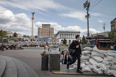 Kyiv's central Maidan Nezalezhnosti (Independence Square) has been fitted out with sandbags and anti-tank 'hedgehogs' in anticipation of an advance by Russian forces. Locals go about their daily lives...