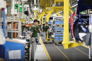 Employees assemble a Jaguar E-Pace compact sport utility vehicle (SUV) on the production line at the second phase of the Chery Jaguar Land Rover Automotive Co. plant. Jaguar Land Rover is building an...