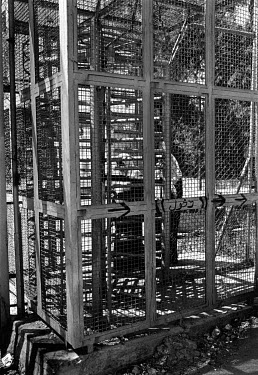 The caged turnstile at the entrance to Deheisha camp.