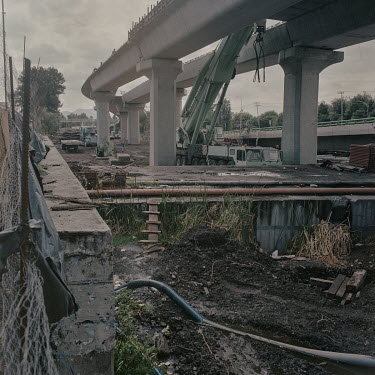 The construction site of a six-lane road bridge that destroyed at least three hectares of the Xochimilco wetland. This area is crucial for the city â��'s ecologicalâ��resilience due to its role as a...
