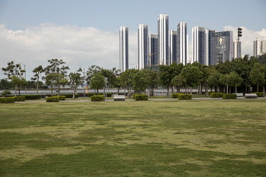 A view of the promenade at Shenzhen Bay and high rise residential buildings.