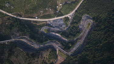 A road twists and turns along a hill near Yangshuo.
