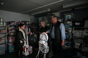 A local couple arrive with donations for the Family Clothing Bank which is run by Jordan McCrimmon (pictured left) in a community centre, which also houses the Brandlesholme foodbank.  Local elections...