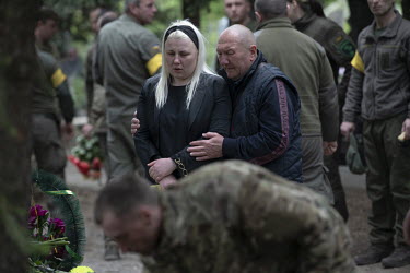 The family and comrades from his regiment mourning at the funeral of Igor Levitzky, a soldier killed in a Russian shelling attack a week ago.