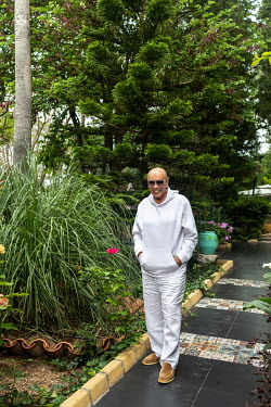 Asil Nadir in the garden of his luxury villa (formerly a nunnery).