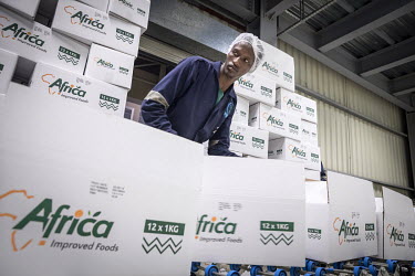 Staff packing the finished product at Africa Improved Foods, a Rwandan company with a Dutch shareholder, DSM. At the Kigali factory they make a special breakfast porridge using locally bought corn des...