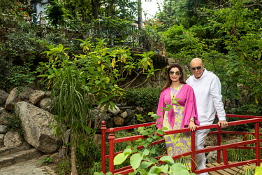 Asil Nadir (right) and his wife Nur Nadir (left) in the garden of their luxury villa (formerly a nunnery).