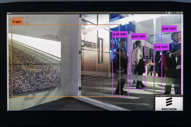 A screen displays a demonstration of facial recognition software at the Ericsson AB booth at the Mobile World Congress.
