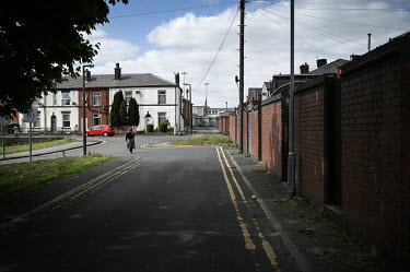 A woman walks through the East Ward area in the centre of town.  Local elections are due in the political constituency of Bury North on 27 April 2022, a traditionally Labour Party seat that turned to...