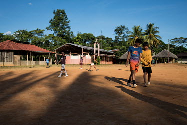 Children playing the large square that the community is organised around and where important events take place. The main community includes several schools, an old mission, a women's house and a commu...