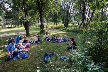 Silje tells stories to children who attend the Hansemyra Barnehage forest kindergarten.