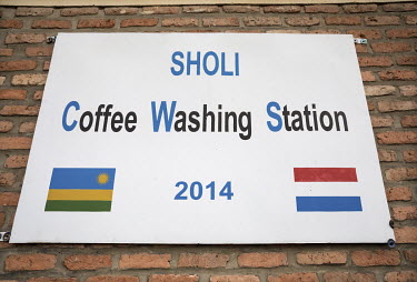 A sign at the Sholi cooperative (meaning 'mutual assistance') which consists of 334 coffee farmers, who grow coffee beans in the hills at an altitude between 1800 and 2000 metres. The organisation was...