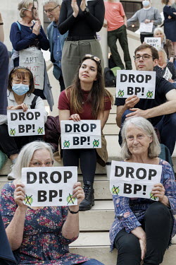 People hold up 'Drop BP!' signs at the British Museum where climate activist group 'BP or not BP' staged a 'Drop BP' event, calling for an end to BP sponsorship.