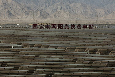 Photovoltaic panels at the Golmud Solar Park on the outskirts of the city. China leads the world in solar energy production with most its solar power generated in its western provinces and transferred...
