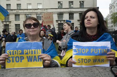 On day 66 of Russia's war in Ukraine, two women hold signs reading 'Stop Putin, Stop War' while attending a regular vigil in Whitehall, opposite Downing Street, where Ukrainians gather to protest Russ...