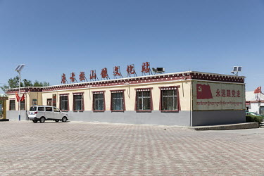 Government propaganda is displayed in a showcase ethic Tibetan village in Golmud. Golmud has grown in importance and substance as a strategic town on the Tibetan plateau as it serves as a military sta...