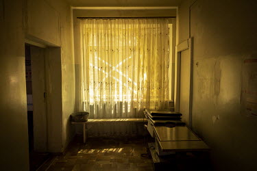 A window at a military hospital close to the frontline in an undisclosed location in Donetsk that is covered so light can't be seen from outside and also has tape on the glass to limit the damage in c...