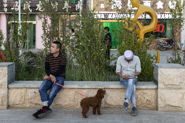 Residents relax in a square.