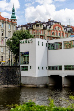 The Manes Gallery straddling a branch of the Vltava River. Toyen (Marie Cerminova) joined the Manes art association and took part in the great Poetry 32 exhibition, which brought her into contact with...